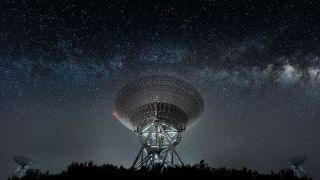 Radio telescope dishes pointing towards the Milky Way galaxy