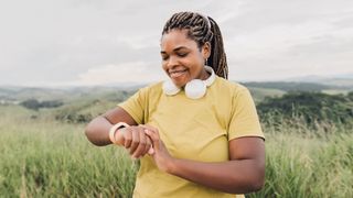 A woman checking her fitness tracker