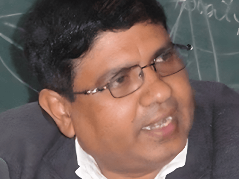 Ananta Giri wearing a dark suit while talking